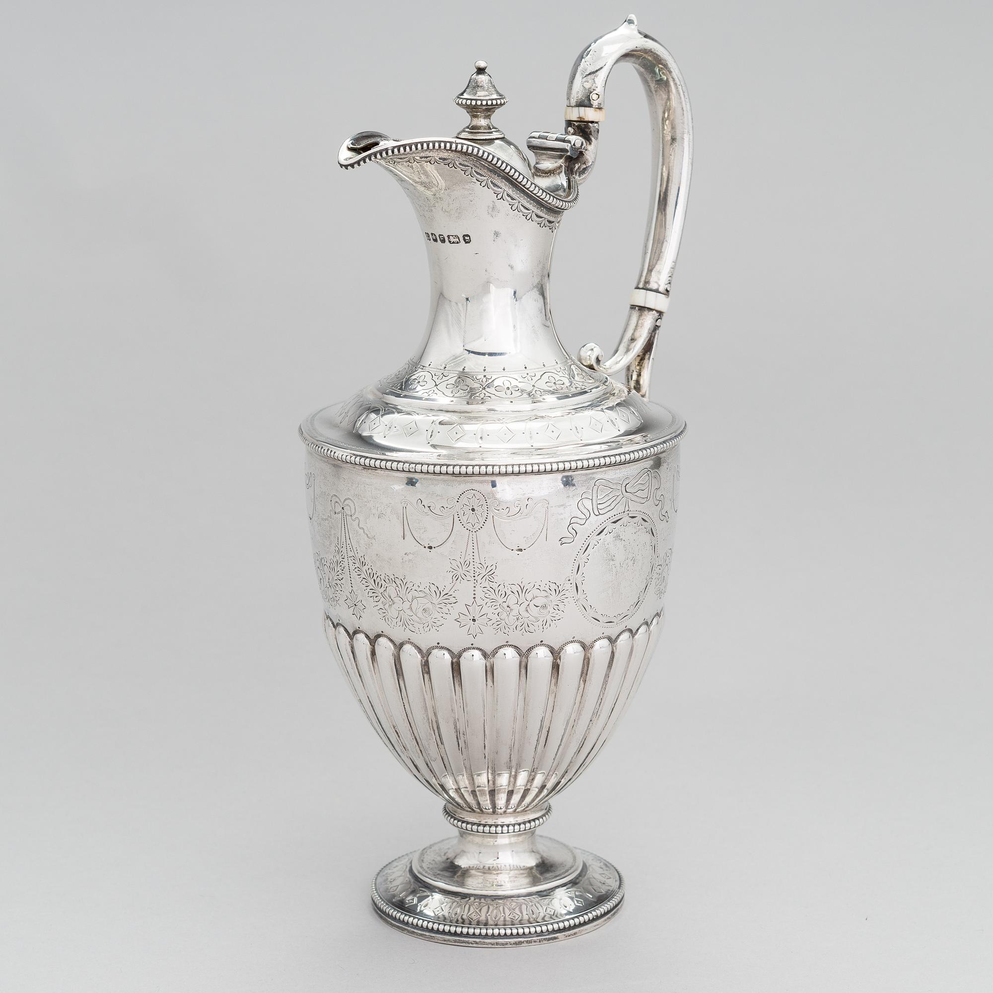 MARTIN, HALL & CO, A sterling silver pitcher, Sheffield 1873.