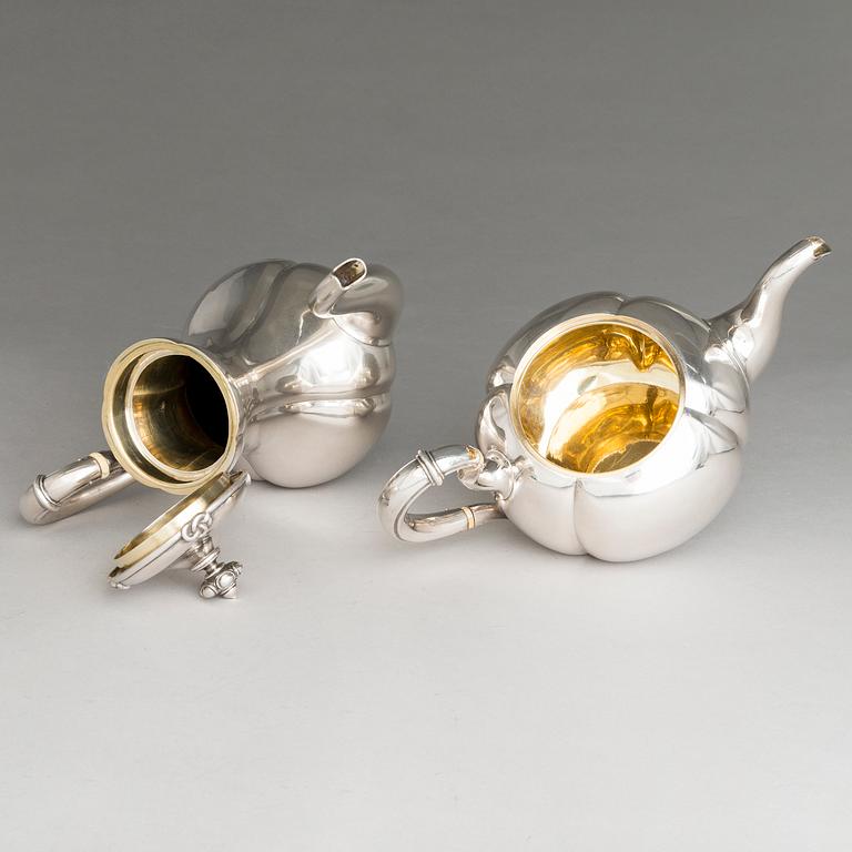 SAZIKOV, A 5-piece silver coffee and tea set, mark of the Sazikov Firm, Imperial Warrant, Saint Petersburg 1860.