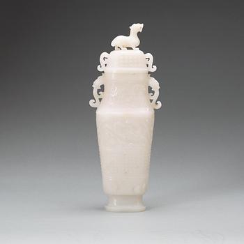 A archaistic carved white stone vase with cover.