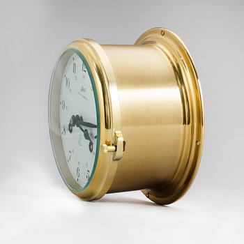 A brass wall clock, Schatz, Royal Mariner, second half of the 20th century.