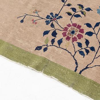 An antique Chinese carpet, c. 293 x 243 cm.