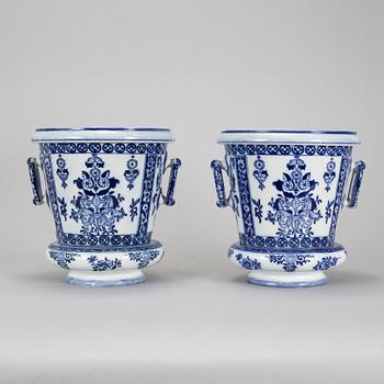 A pair of Petrus Regout & Co, Maastricht pots with bases, Delft, 20th century.