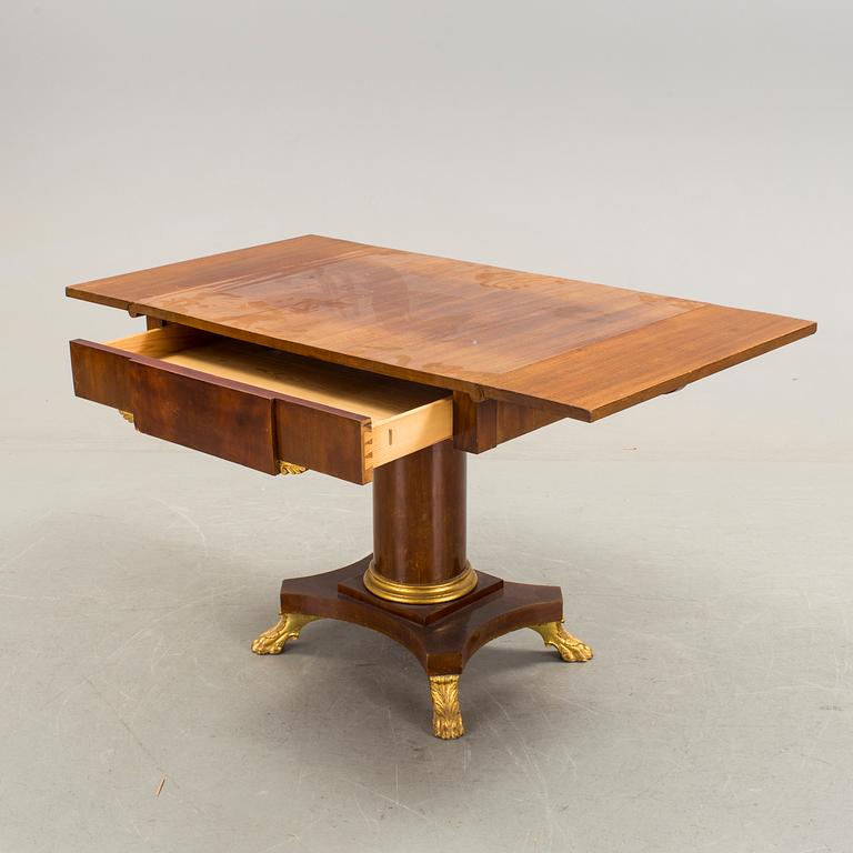 A mahogany table in Karl Johan style early 20th century.