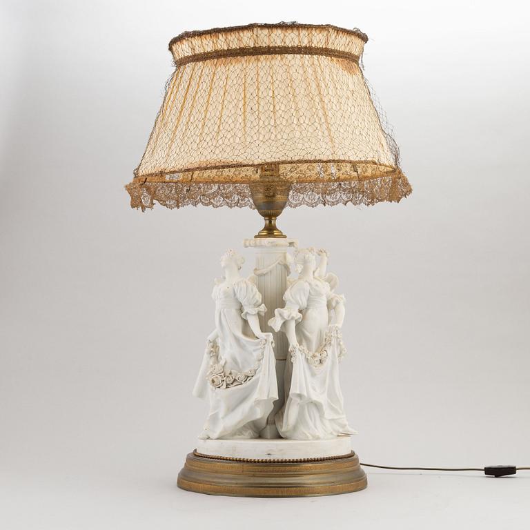 A parian and metall table lamp, first half of the 20th century.