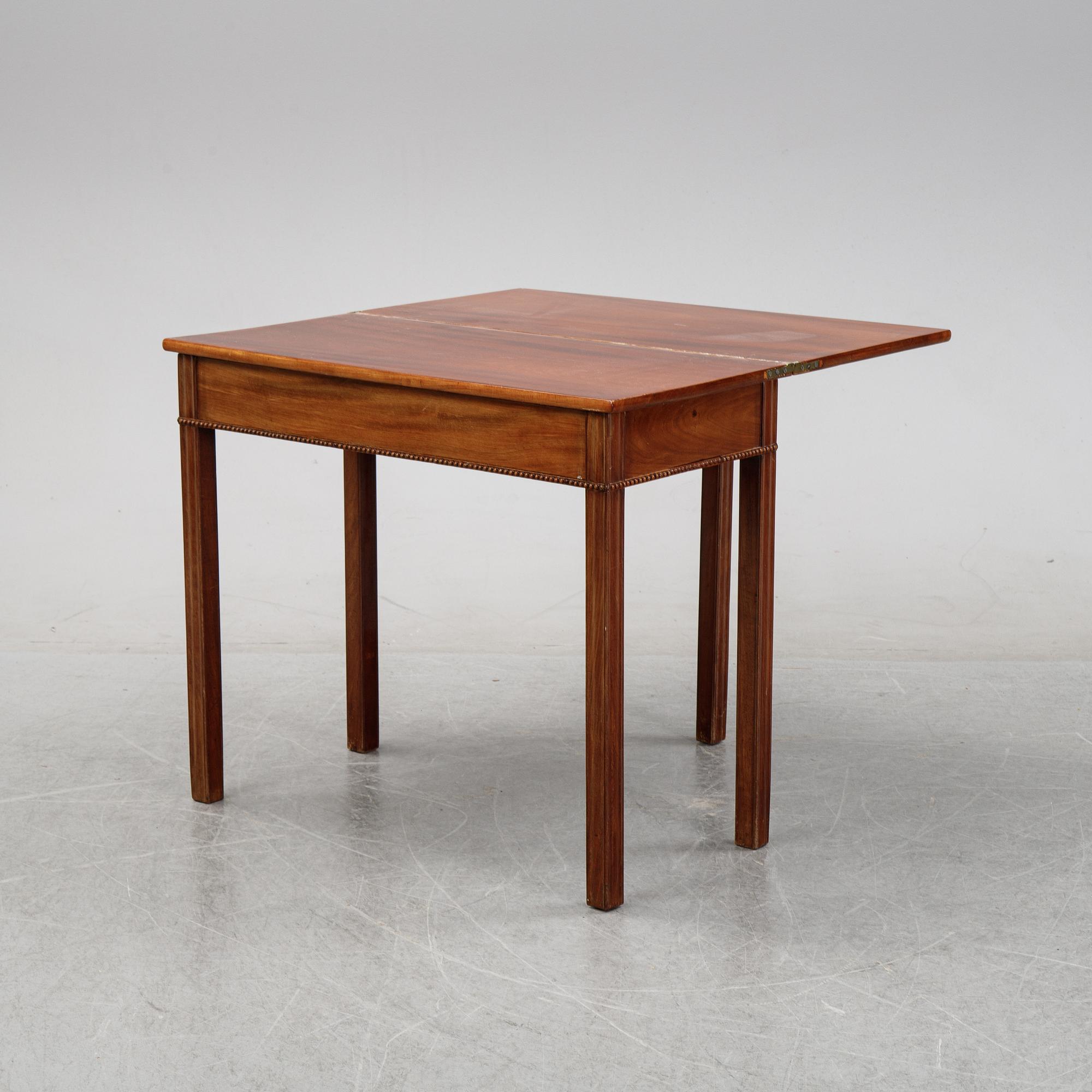 A mahogany games table, circa 1800.