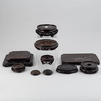 A group of chinese wooden stands, 19th/20th Century. (12 pieces).