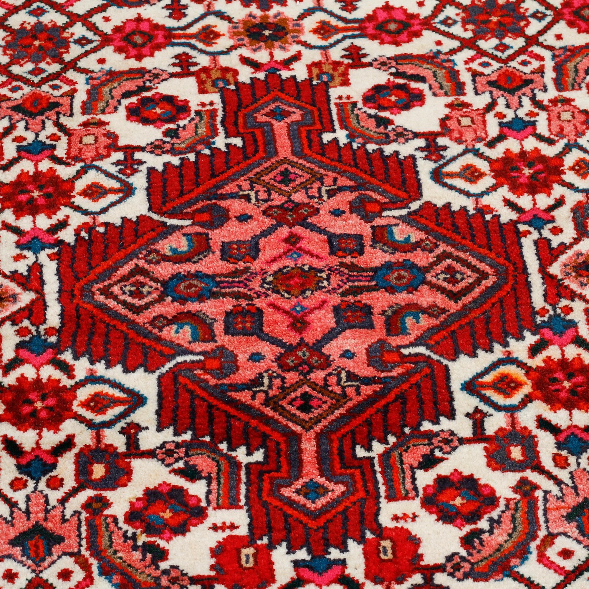 A Hosseinabad rug, 281 x 106 cm.