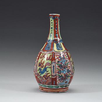 A 'clobbered' bottle vase, Ming dynasty, Wanli (1572-1620).