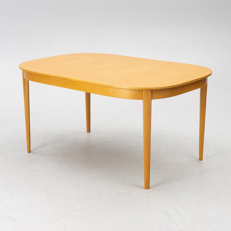 Carl Malmsten, a dining table with eight chairs, 'Camlare Nyckel', Sweden, second half of the 20th century.