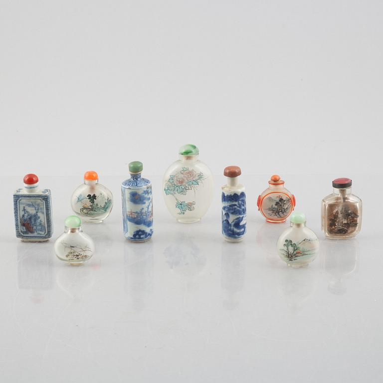 A group of nine Chinese glass and porcelain snuffbottles, 20th century.