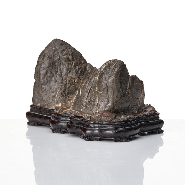 A Japanese rock sculpture, 20th Century. Signed at the base.