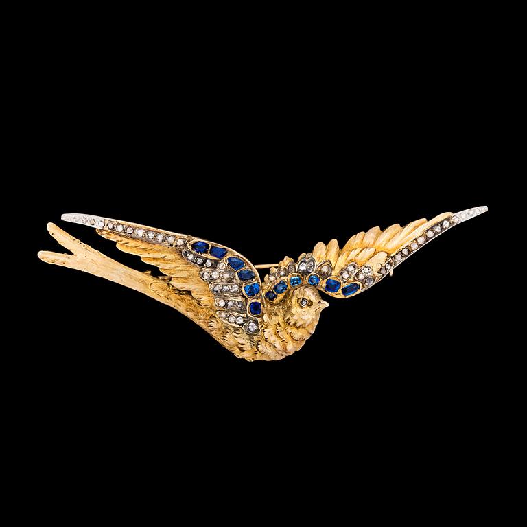 A gold, diamond and blue sapphire bird brooch, c. 1900.