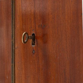 A late Gustavian mahogany chamberpot cupboard, circa 1800.