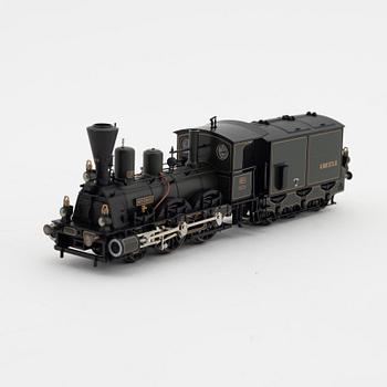 Märklin, a steam locomotive 3497 and car set no 4897, in boxes.