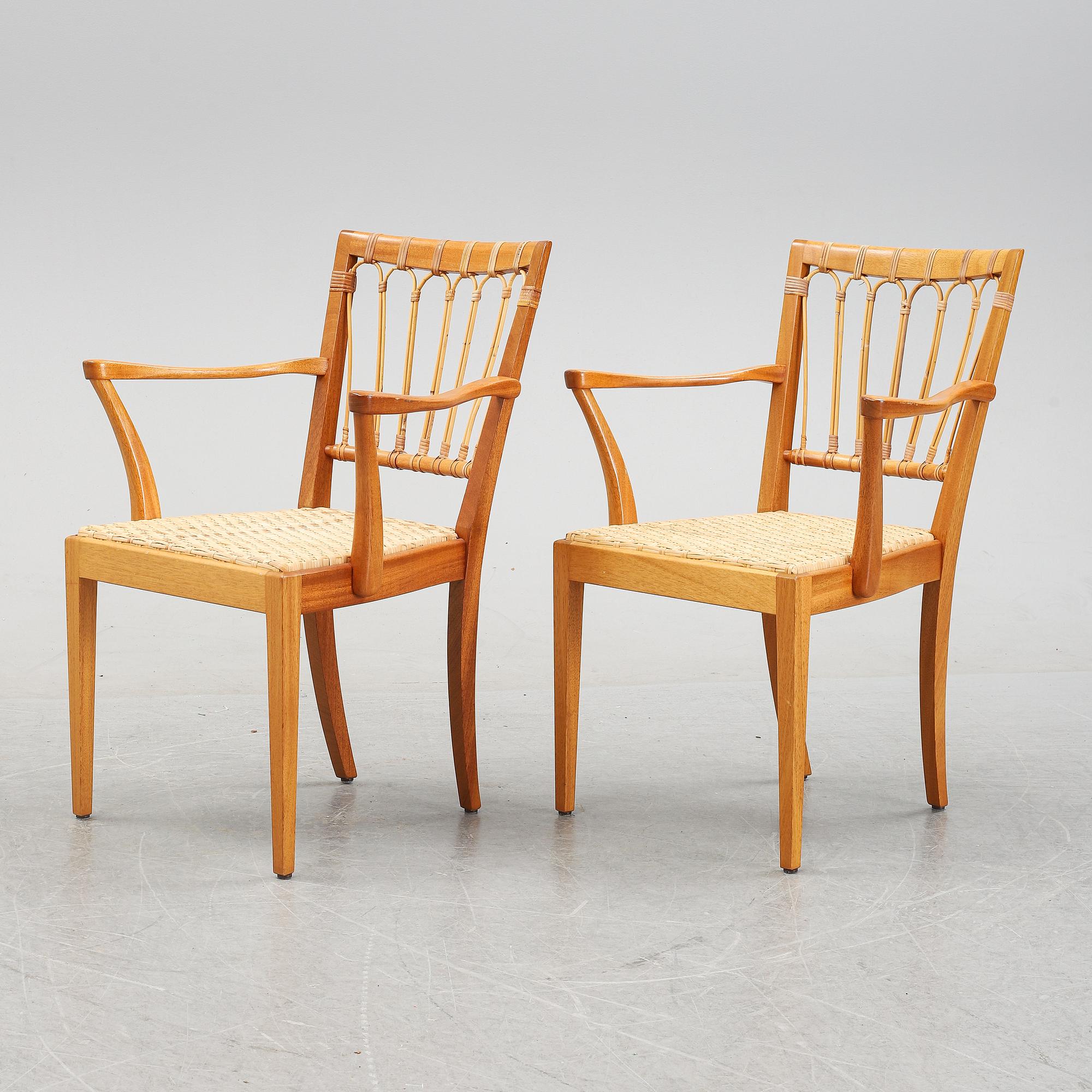A pair of mahogany armchairs, model 1165, designed by Josef Frank in 1946 for Firma Svenskt Tenn.