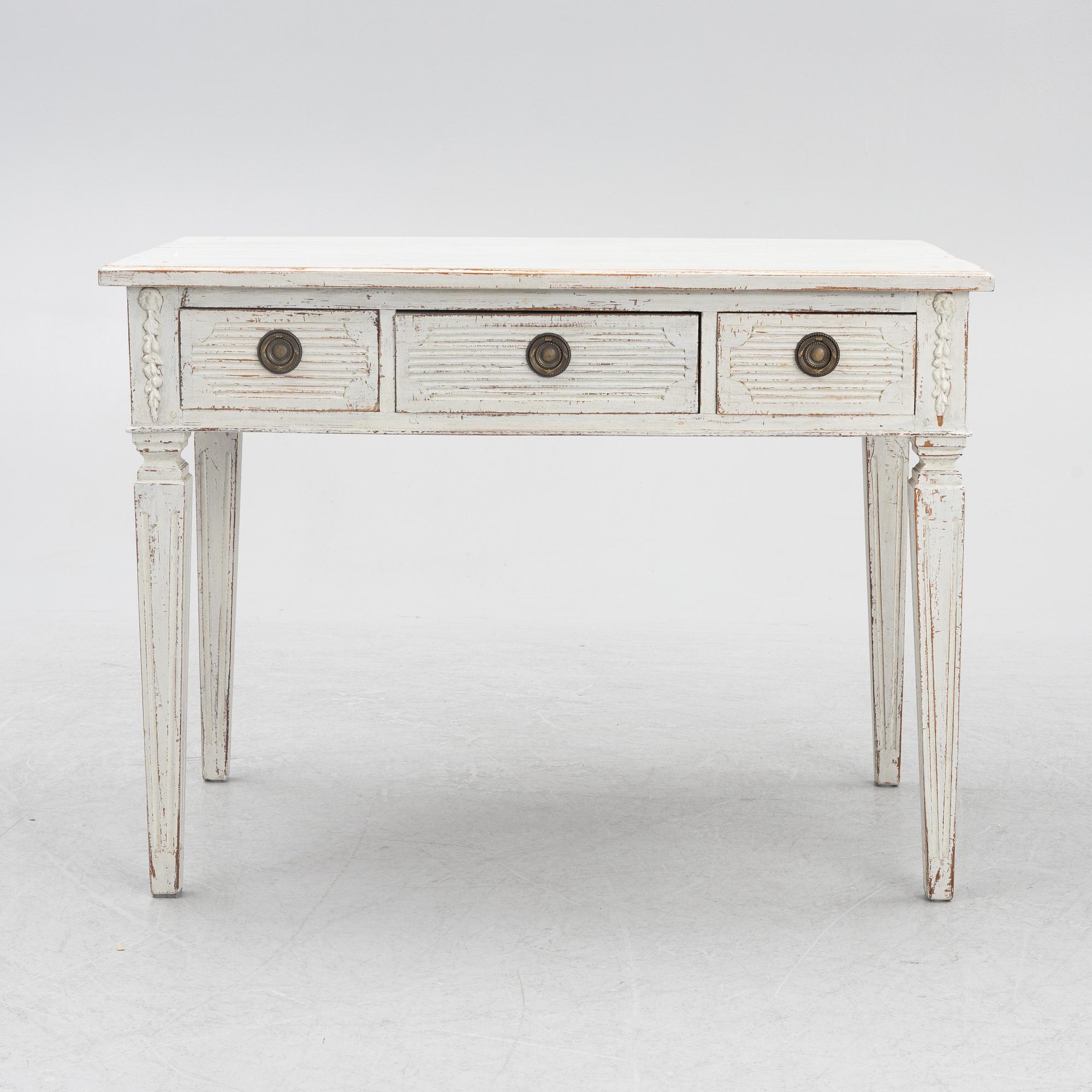 A late 19th century desk and an "Odenslunda" chair from IKEAs 18th century series.