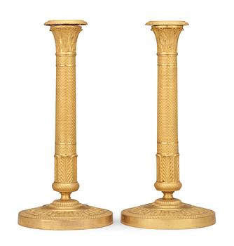 A pair of French Empire early 19th century candlesticks.