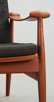 A pair of Finn Juhl teak easy chairs, France & Daverkosen, Denmark.