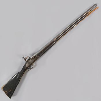 A flintlock rifle, 18th century.