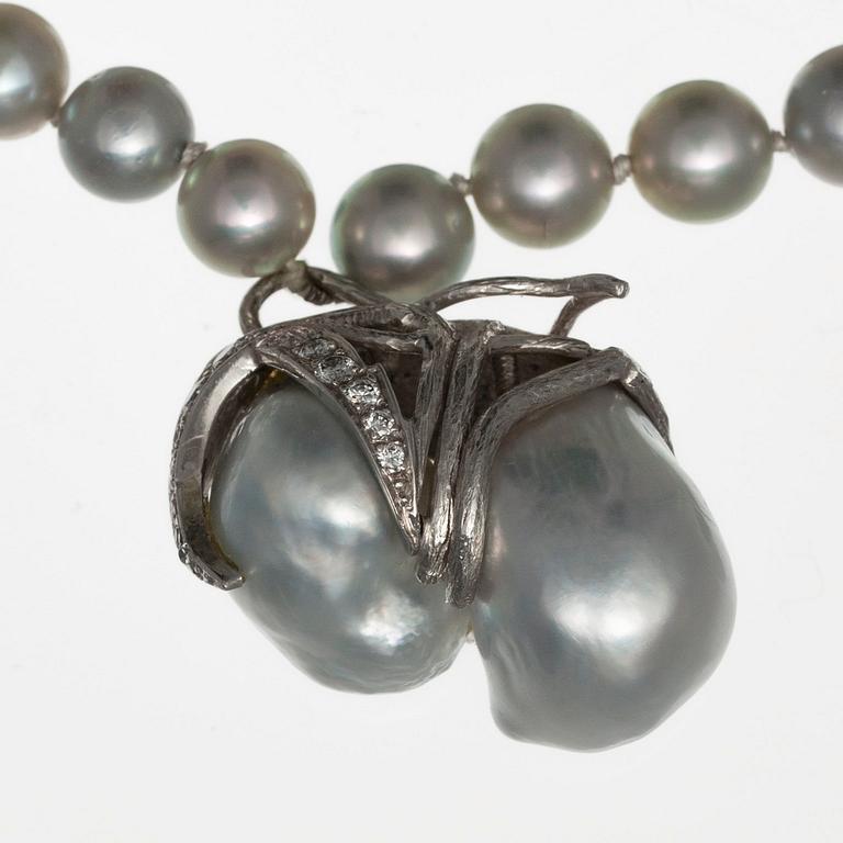 A NECKLACE, 18K white gold, akoya pearls 7 mm and 2 large baroque south sea pearls.