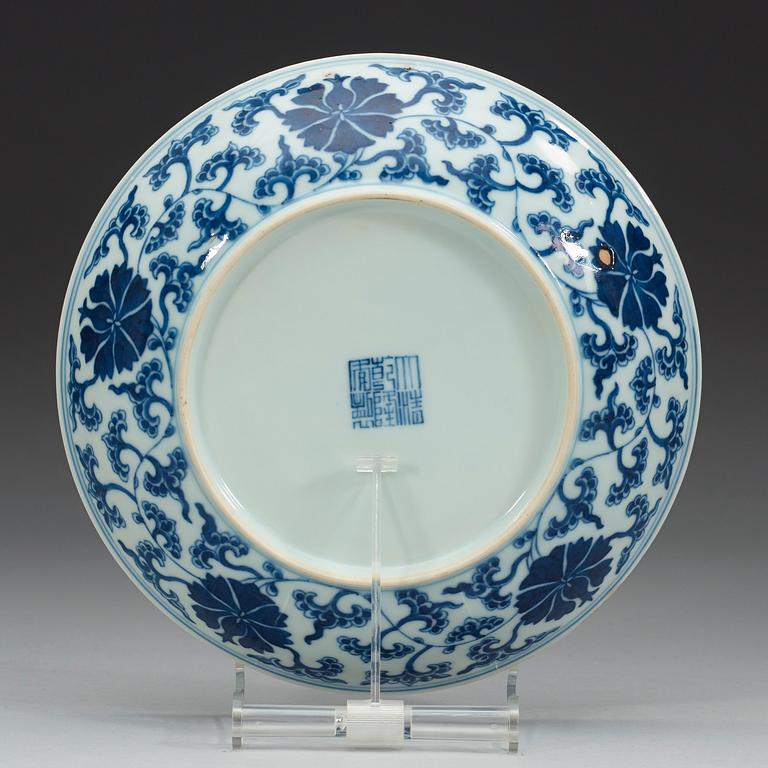 A set of four blue and white lotus dishes, Qing dyanasty with Qianlong sealmark.