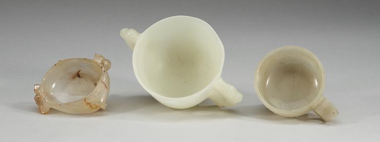 A set of two nepfrite wine cups and a agate brush washer, Qing dynasty.