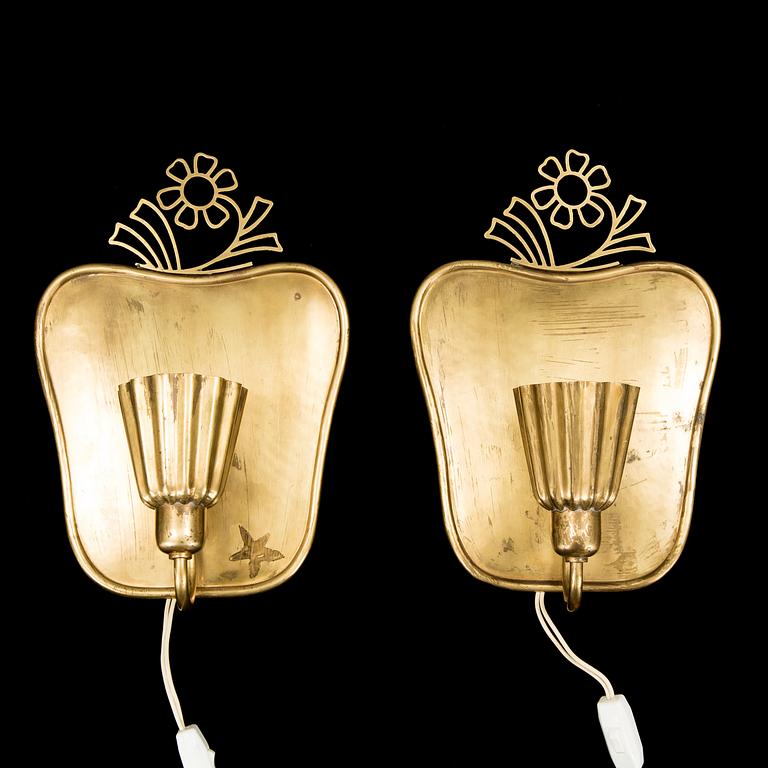 A pair of brass wall-lights by Firma Lars Holström, Arvika.