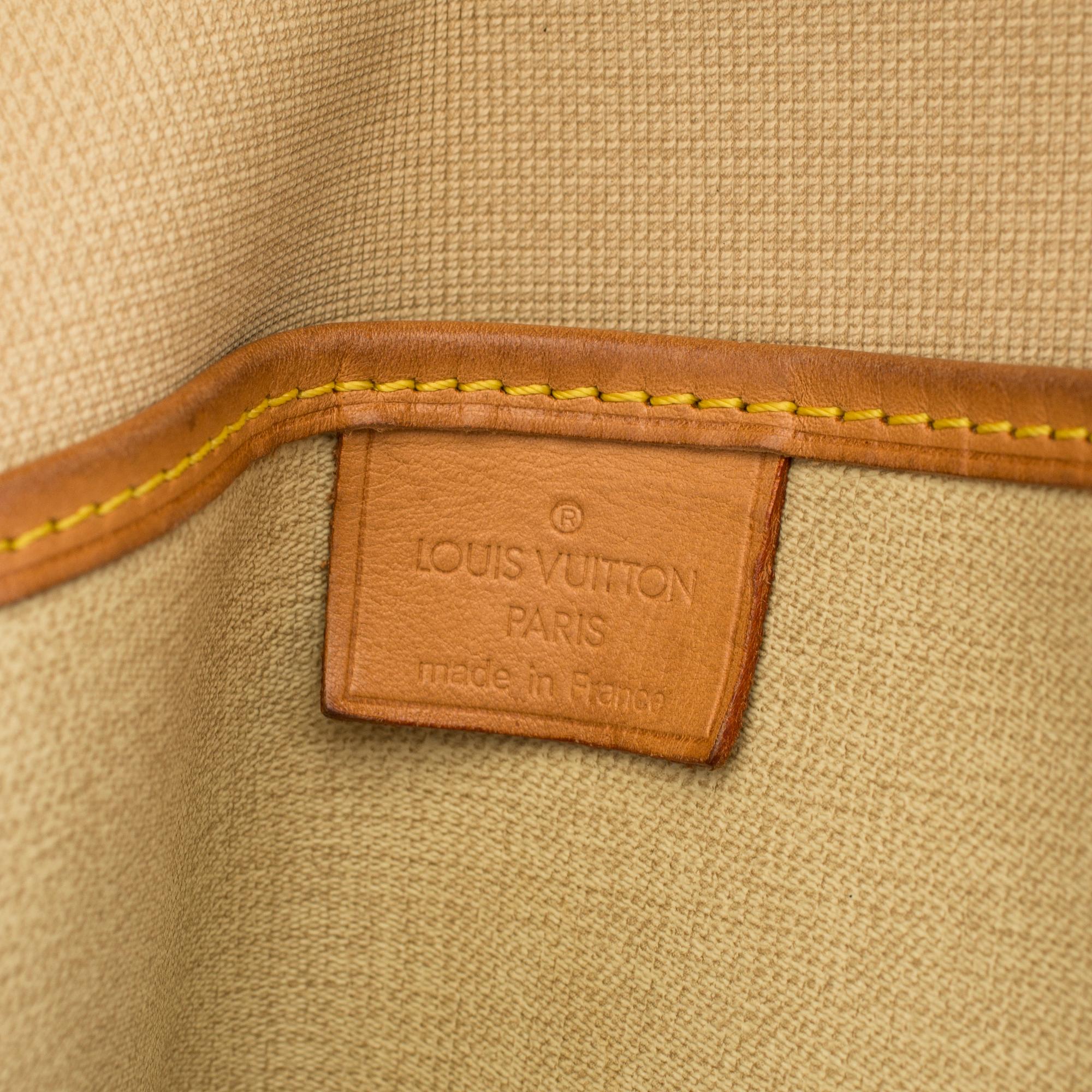 A bag "Excursion" by Louis Vuitton.