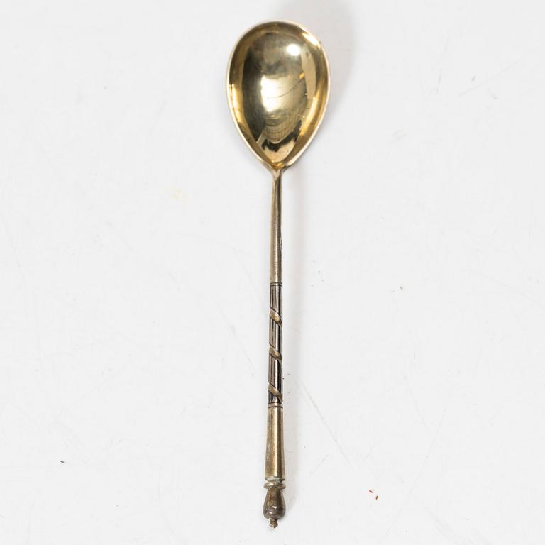 A Russian silver niello napkin ring and spoon, late 19th century-early 20th century.