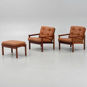 Illum Wikkelsö, a pair of 'Capella' armchairs and an ottoman, second half of the 20th century.