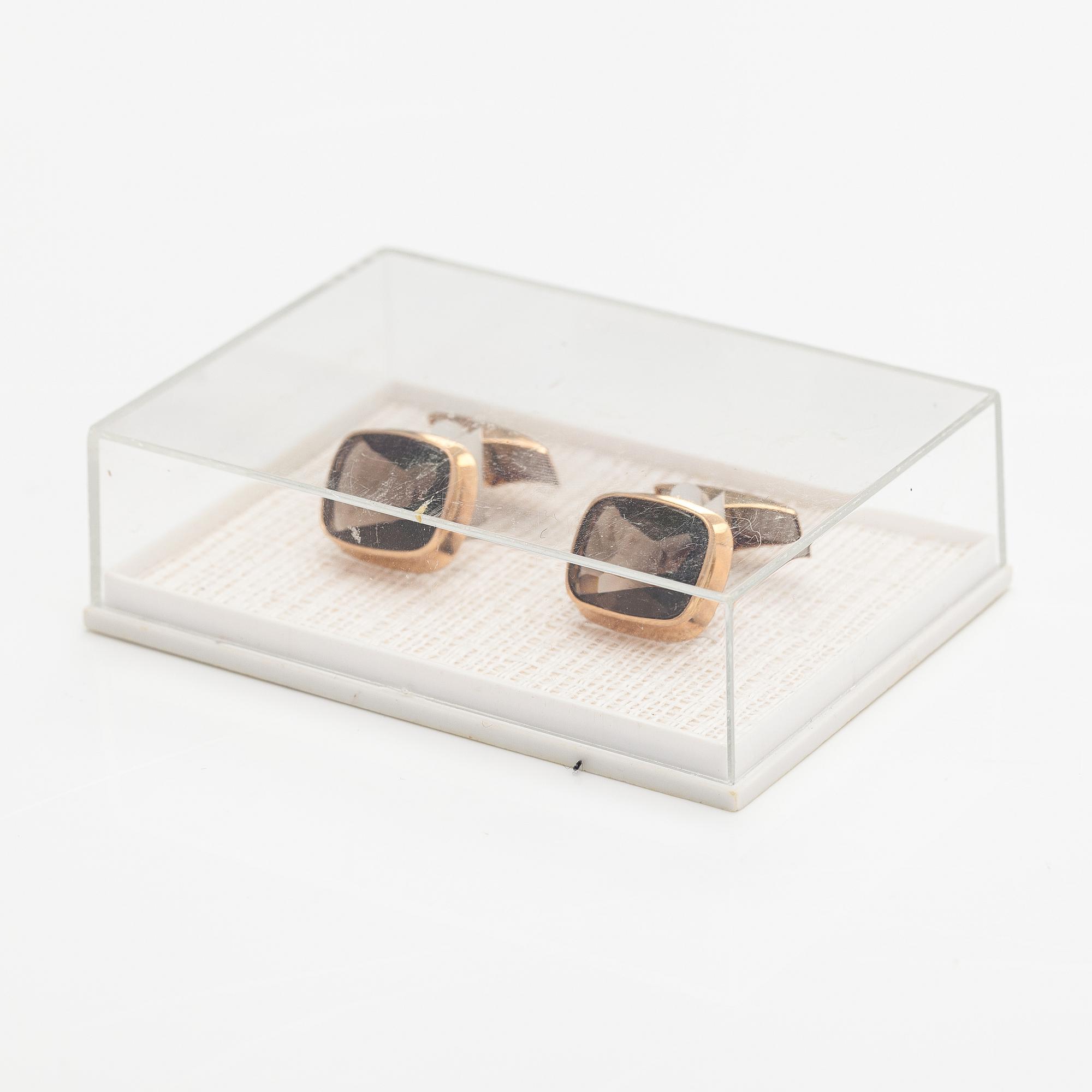 A pair of 14K gold cufflinks with smoaky quartzes. Liitola & Koistinen kultasepät, Turku 1977.