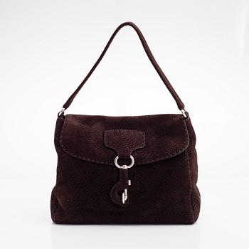 Prada, A leather handbag.