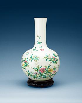 A famille rose vase, late Qing dynasty, with Qianlongs four character mark in red.