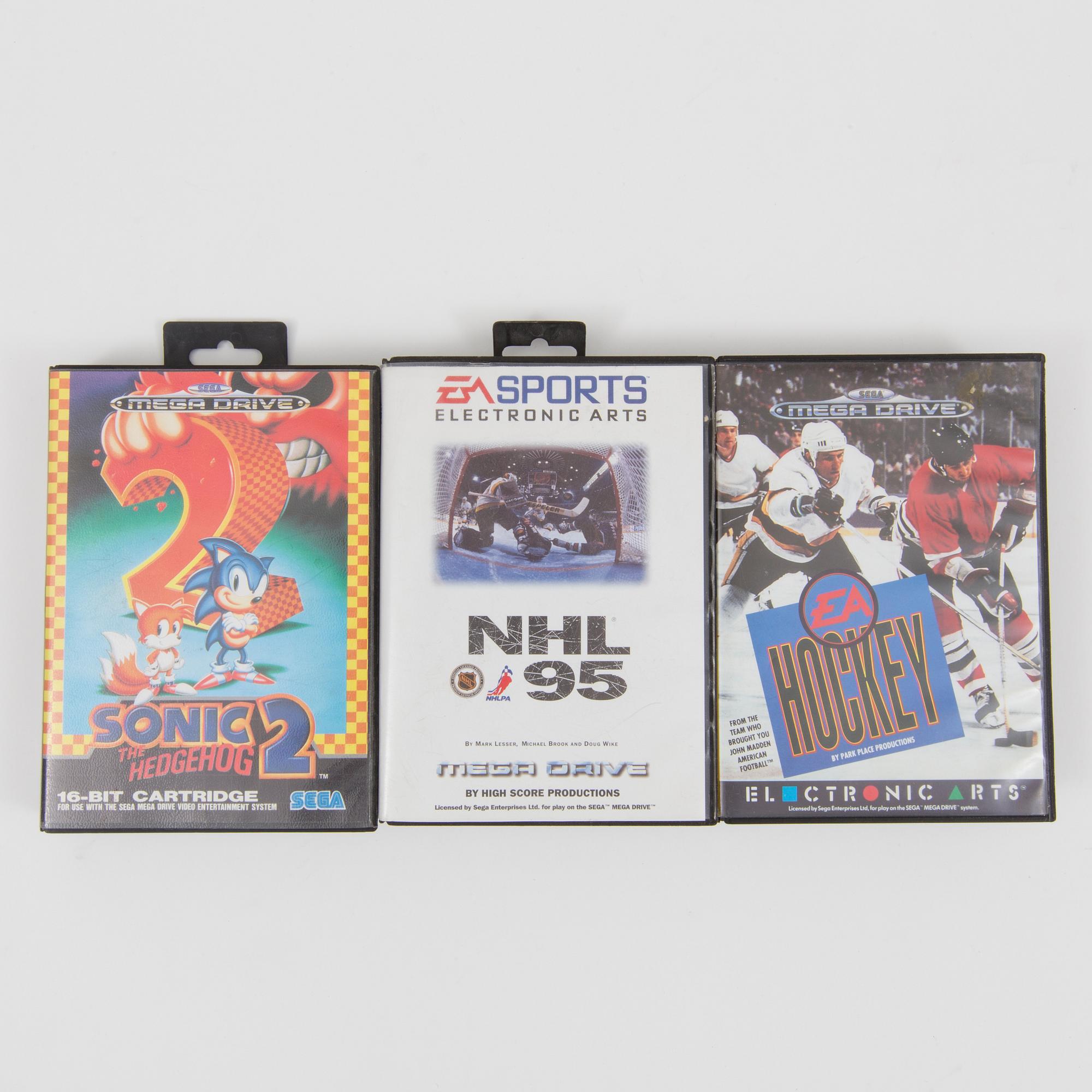 A "Sega Mega Drive" and nine games, 1990.s.