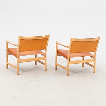 Alf Svensson, a pair of oak and leather armchairs from the second half of the 20th century.