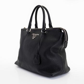 Prada, a leather bag.