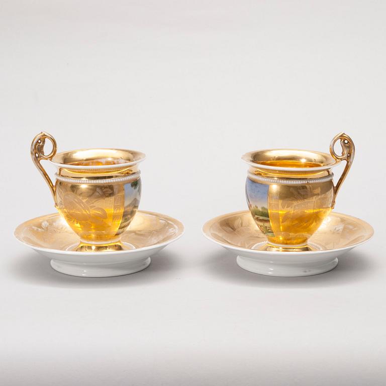 A PAIR OF COFFEE CUPS.