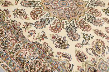 A Kirman Laver carpet, approx. 367 x 267 cm.