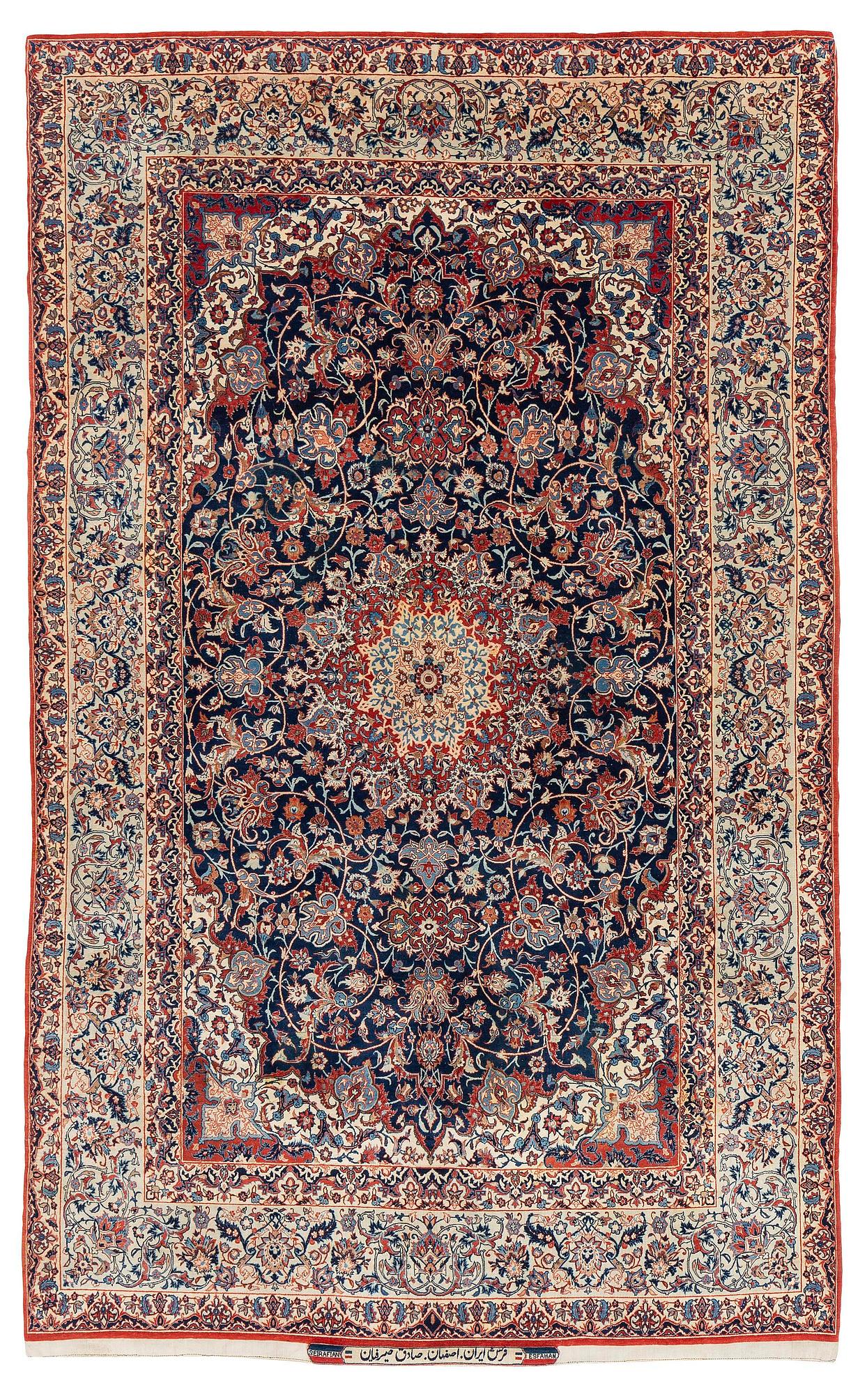 A semi-antique Isfahan rug, signed (Sadegh) Seirafian, c. 244 x 149 cm.