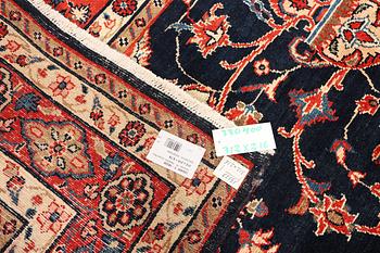 A Hamadan carpet, c. 312 x 216 cm.