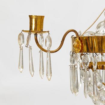 A late Gustavian gilt-brass and cut-glass four-branch chandelier, circa 1800.