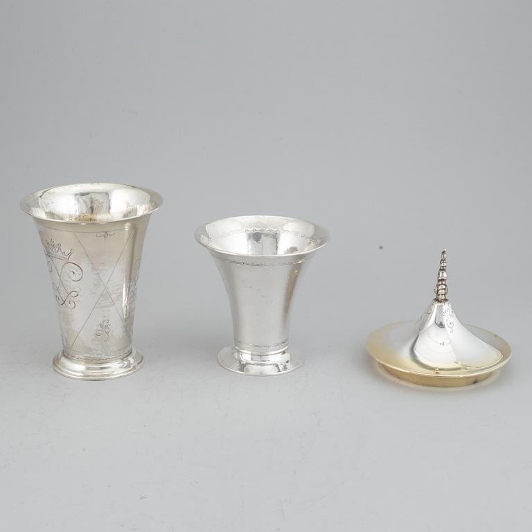Two silver and parcel-gilt beakers and a parcel-gilt lid, maker's mark K. Andersson, Stockholm, 1927, 1922 and 1948.