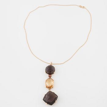 A smokey quartz and citrine pendant.