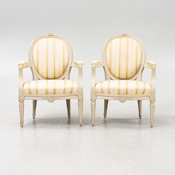 A pair of Gustavian style armchairs signed J.G.A, mid 20th century.