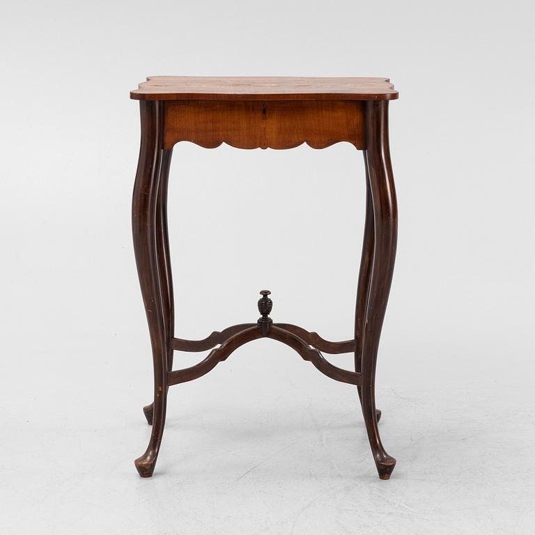 A Rococo style rosewood-veneered and mahogany sewing table, early 20th century.