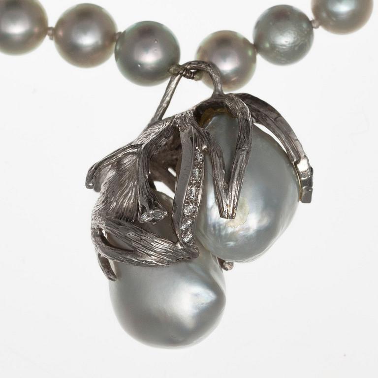 A NECKLACE, 18K white gold, akoya pearls 7 mm and 2 large baroque south sea pearls.