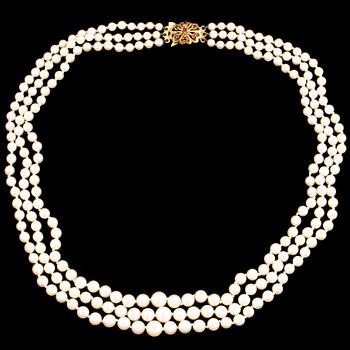 A three strand cultured pearl necklace.
