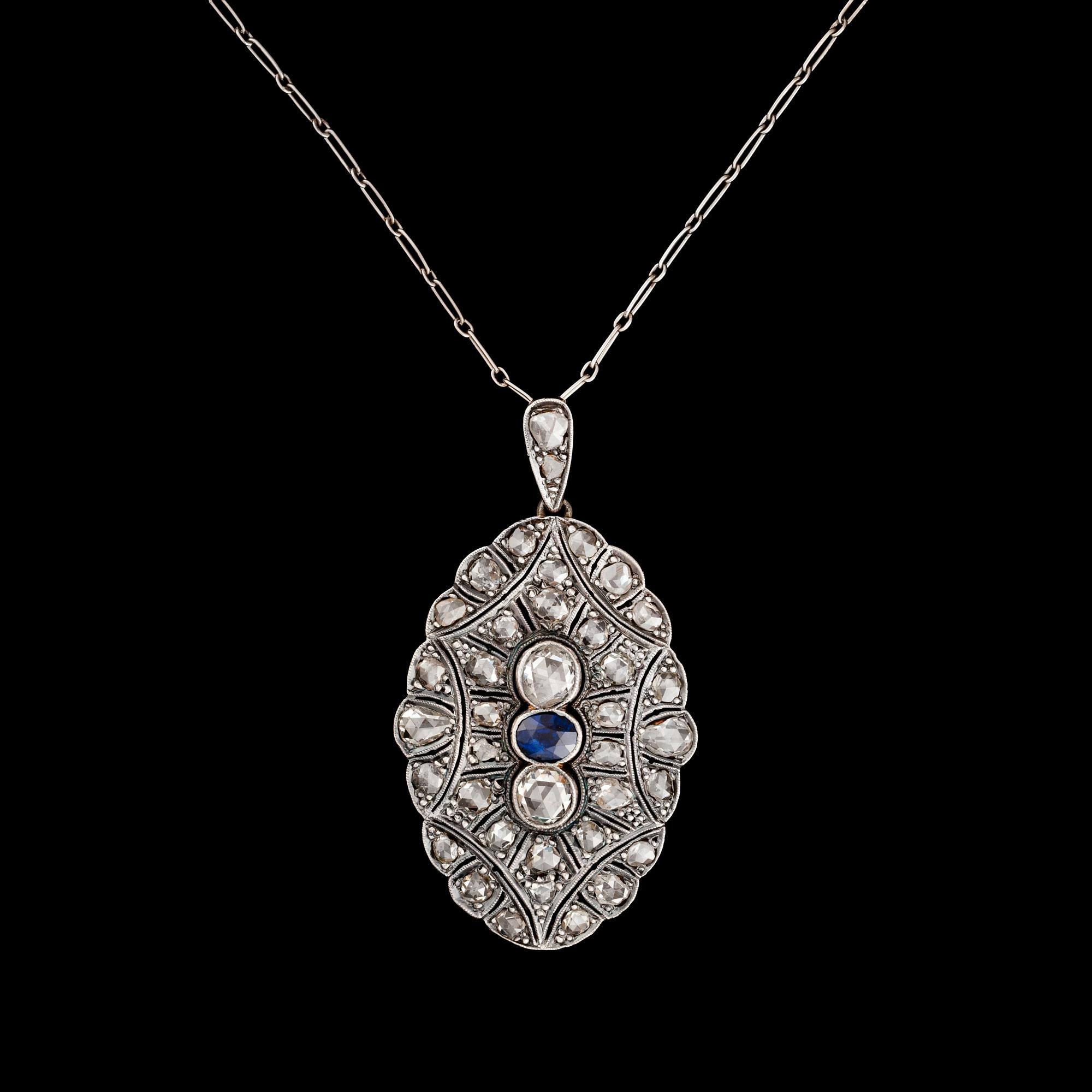HÄNGE, platina och guld, fasettslipad safir ca 0,85 ct med rosenslipade diamanter totalt ca 4,50 ct. Vikt 14 g.