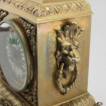 A table clock and two candelabras, around the year 1900.