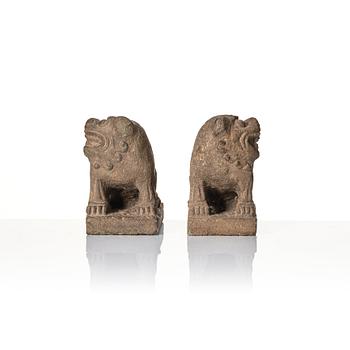 A pair of stone sculptures of buddhist lions, Qing dynasty (1664-1912).